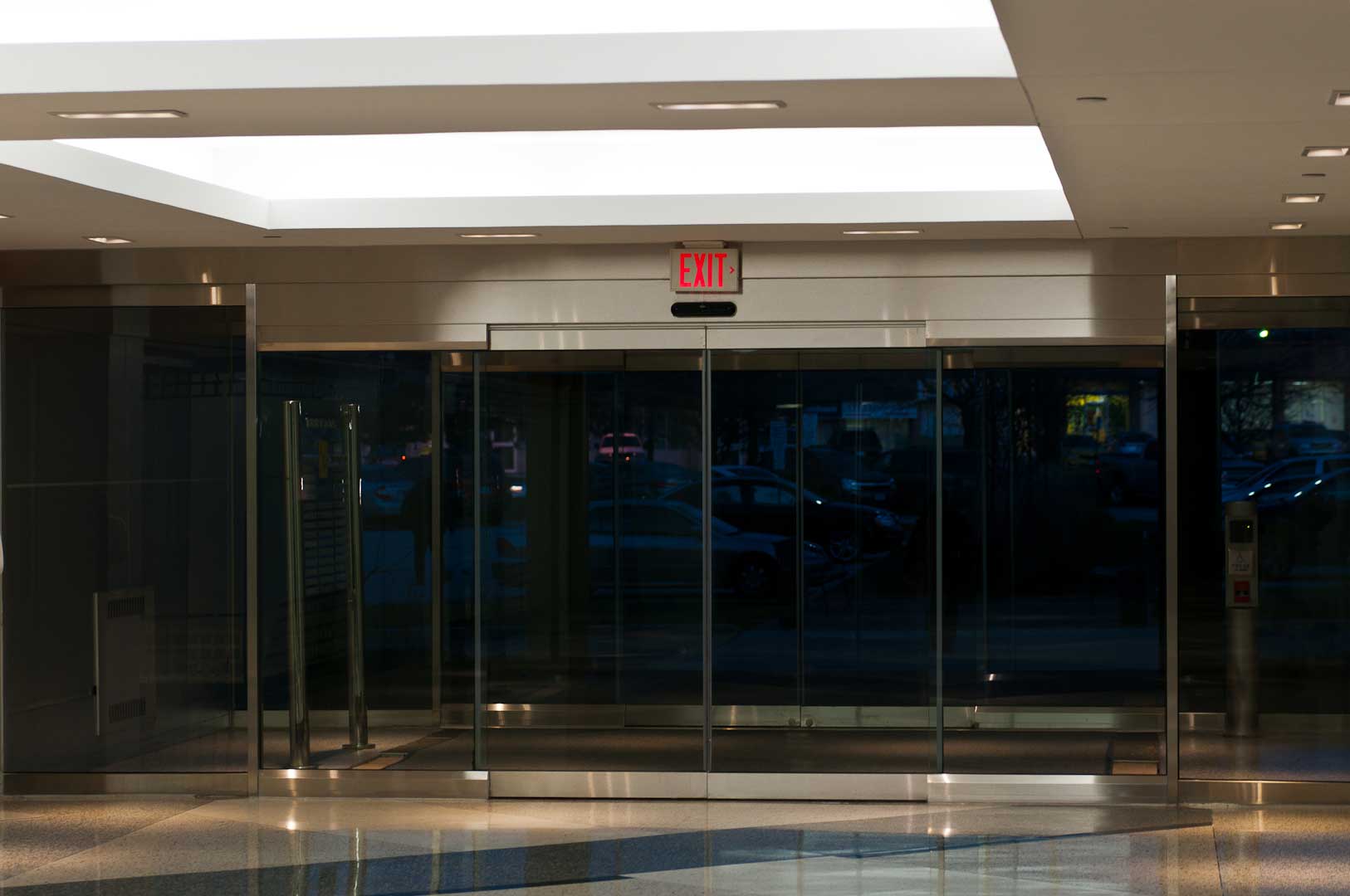 All glass building entrance installed by Explore1.ca in Toronto that features a Tormax Sliding door system