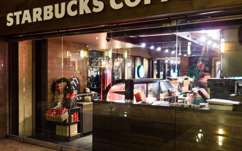 Starbucks Coffee Located at 1 Queen St E. Toronto Glass Storefront built by Explore1.ca