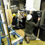 Technician from explore1 prepares IG Units for high-rise installation at OPG