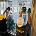 a crew from explore1 installs a high-rise window at OPG
